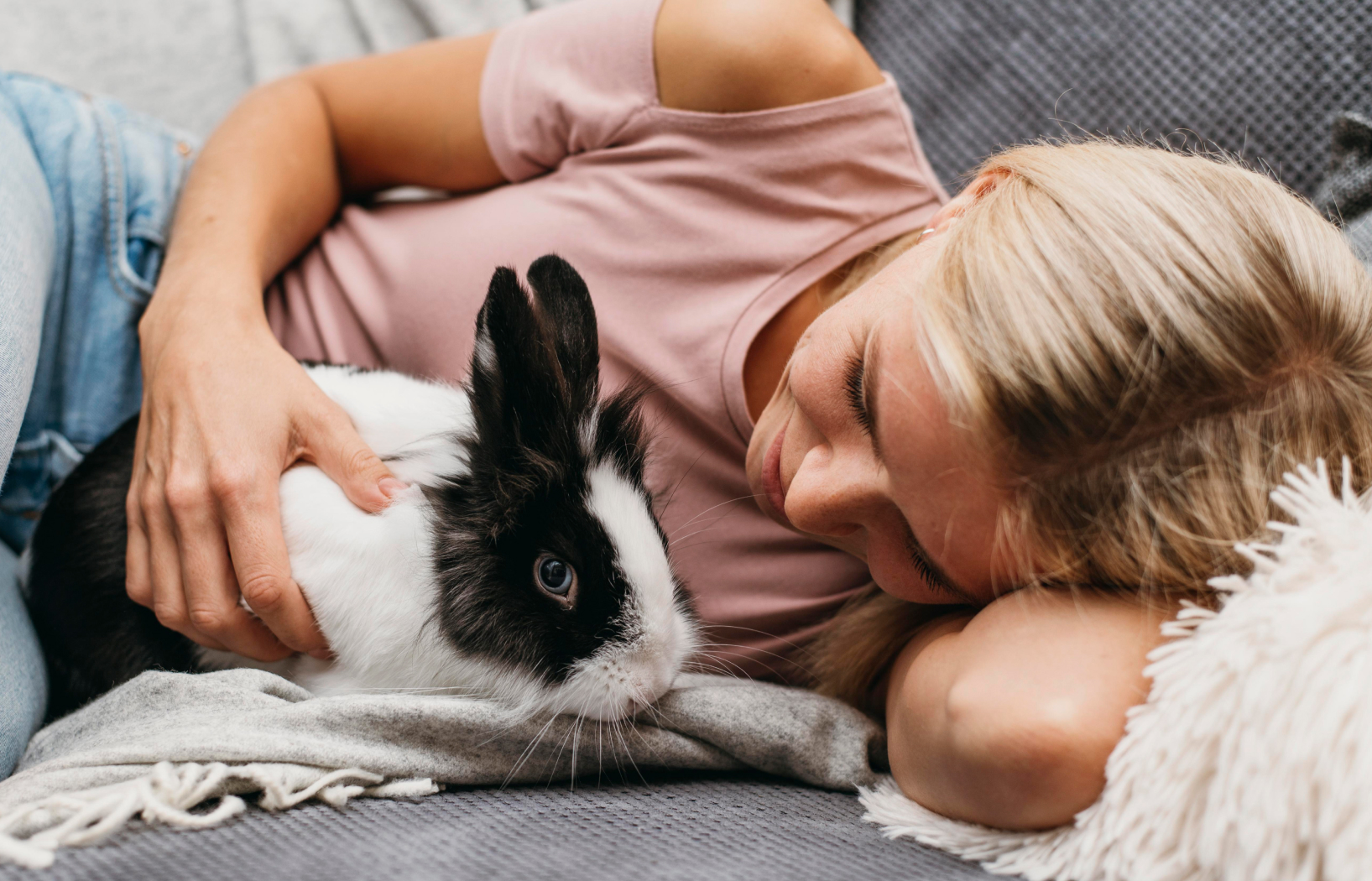 Girl Laying In Bed with Rabbit